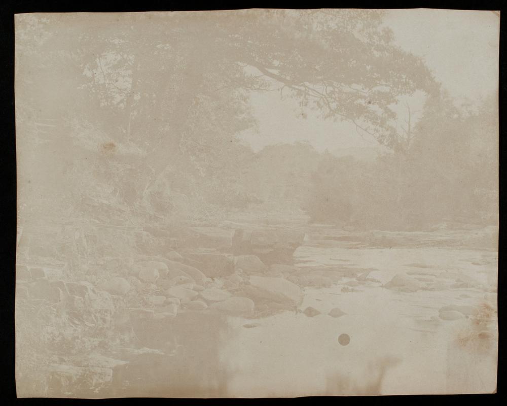 Rock strewn river, photograph