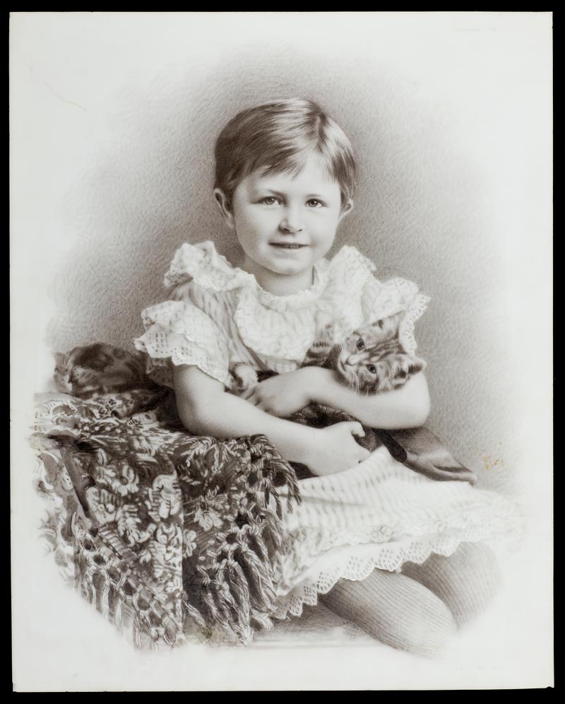 Portrait of a girl holding a cat