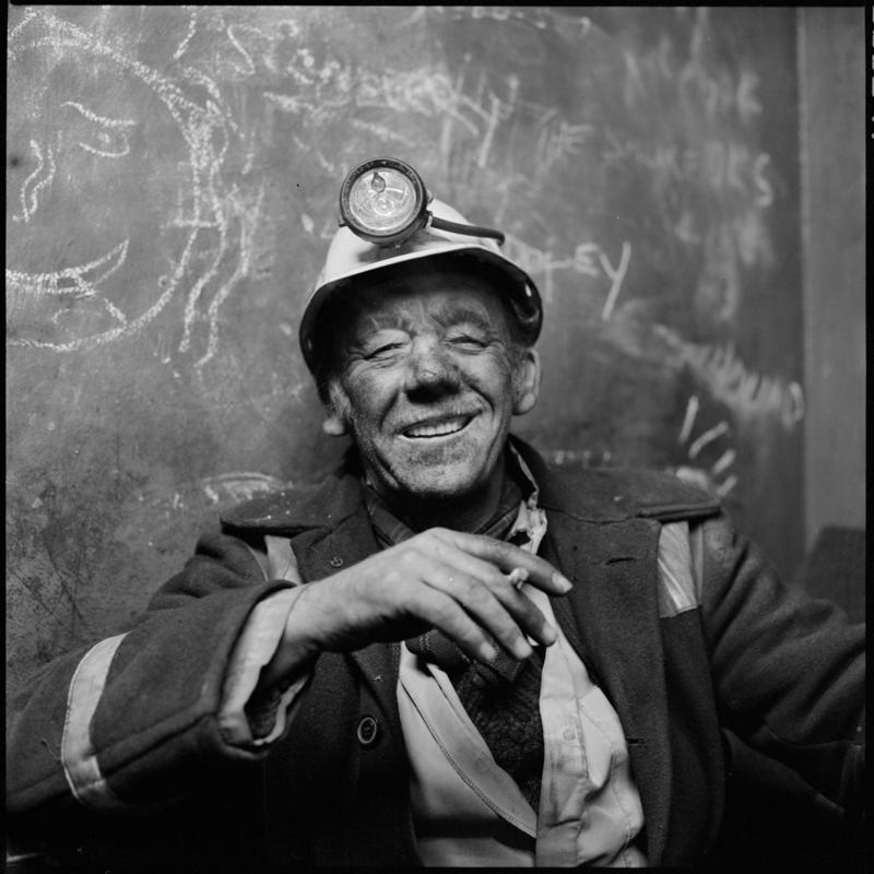 Black and white film negative showing a miner on break, Coegnant Colliery 25 November 1981.  '25 Nov 1981' is transcribed from original negative bag.