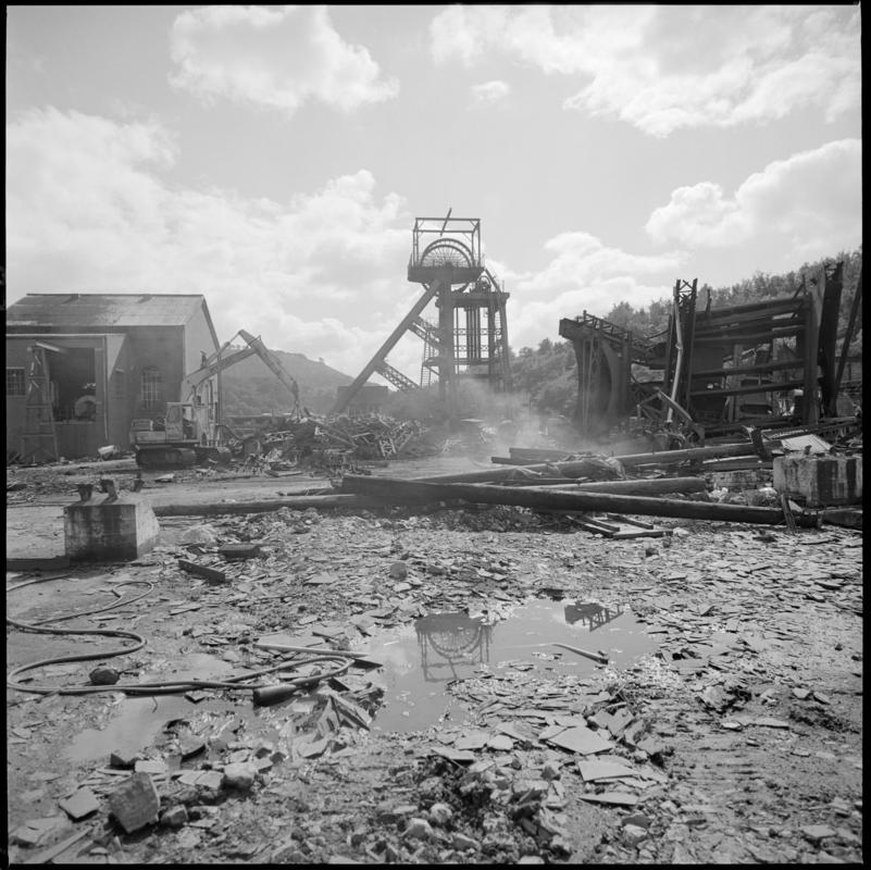 Black and white film negative of a photograph showing demolition at Celynen South Colliery, 1985.  'South Celynen' is transcribed from original negative bag.  Appears to be identical to 2009.3/2484.