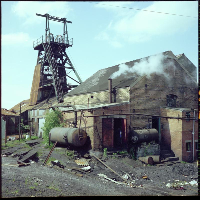 Colour film negative showing a view of the headgear and engine house, Morlais Colliery 13 May 1981.  'Morlais 13/5/81' is transcribed from original negative bag.  Appears to be identical to 2009.3/1824.