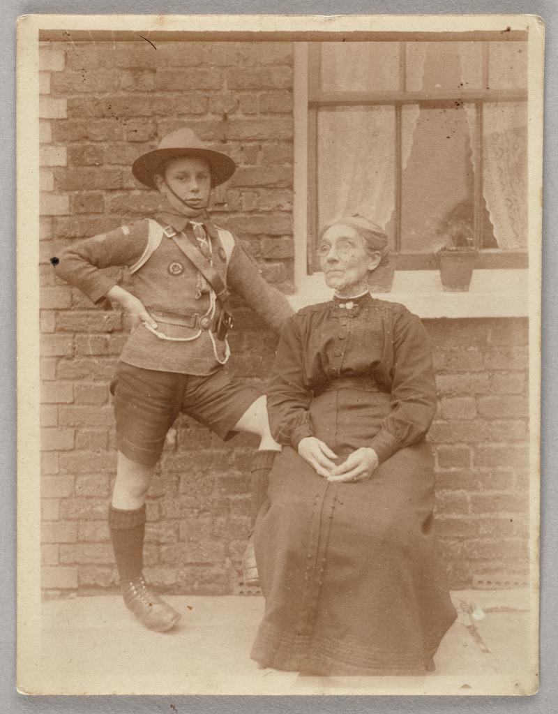 Young C.H. Watkins when a boy scout, with elderly lady.