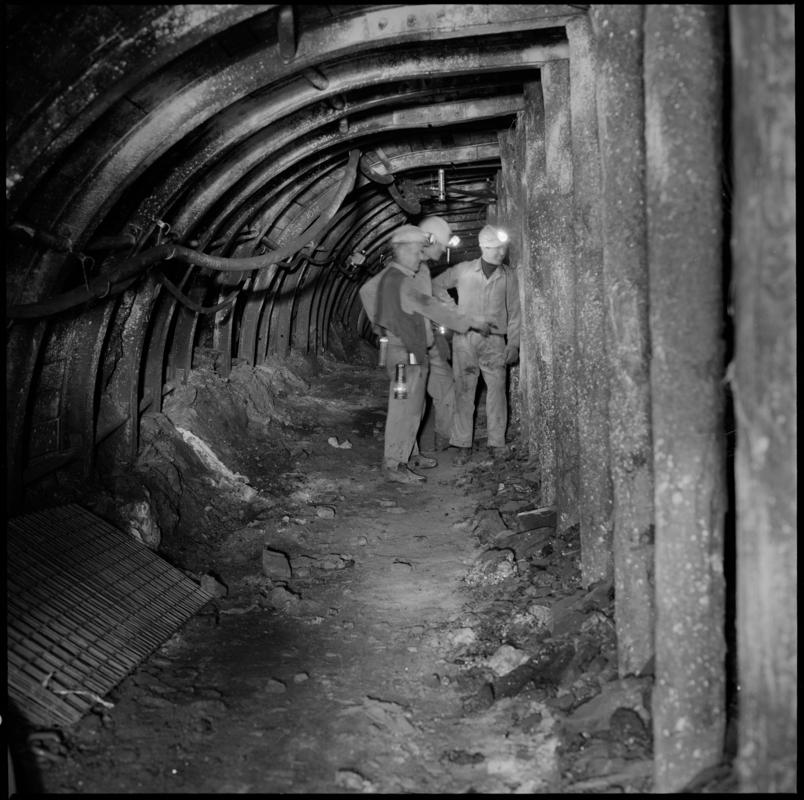 Colour film negative showing three men underground at Cwm Colliery.  'Cwm' is transcribed from original negative bag.
