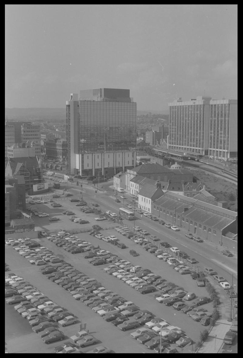 View to north east Butetown from building in Bute Terrace, with Helmont House (Churchill Way) and Brunell House in background, and car parks in foreground.