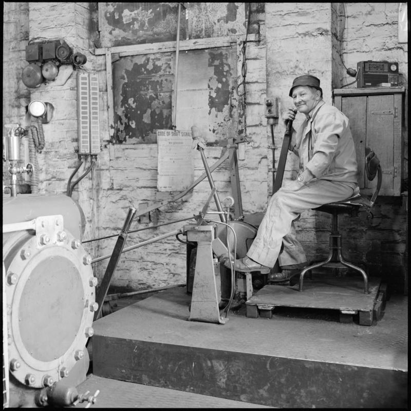 Black and white film negative showing a man operating the Andrew Barclay steam winder, Morlais Colliery 13 May 1981.  'Morlais 13/5/81' is transcribed from original negative bag.