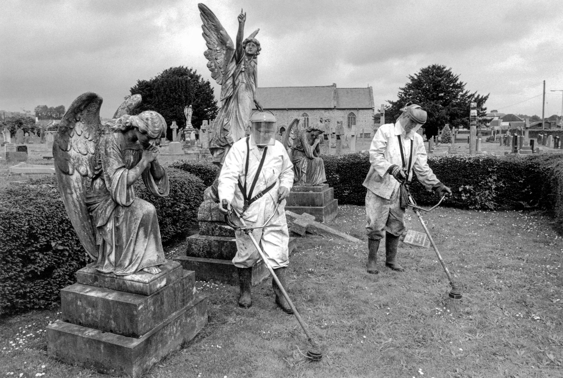 Churchyard maintenance. Llandovery, Wales