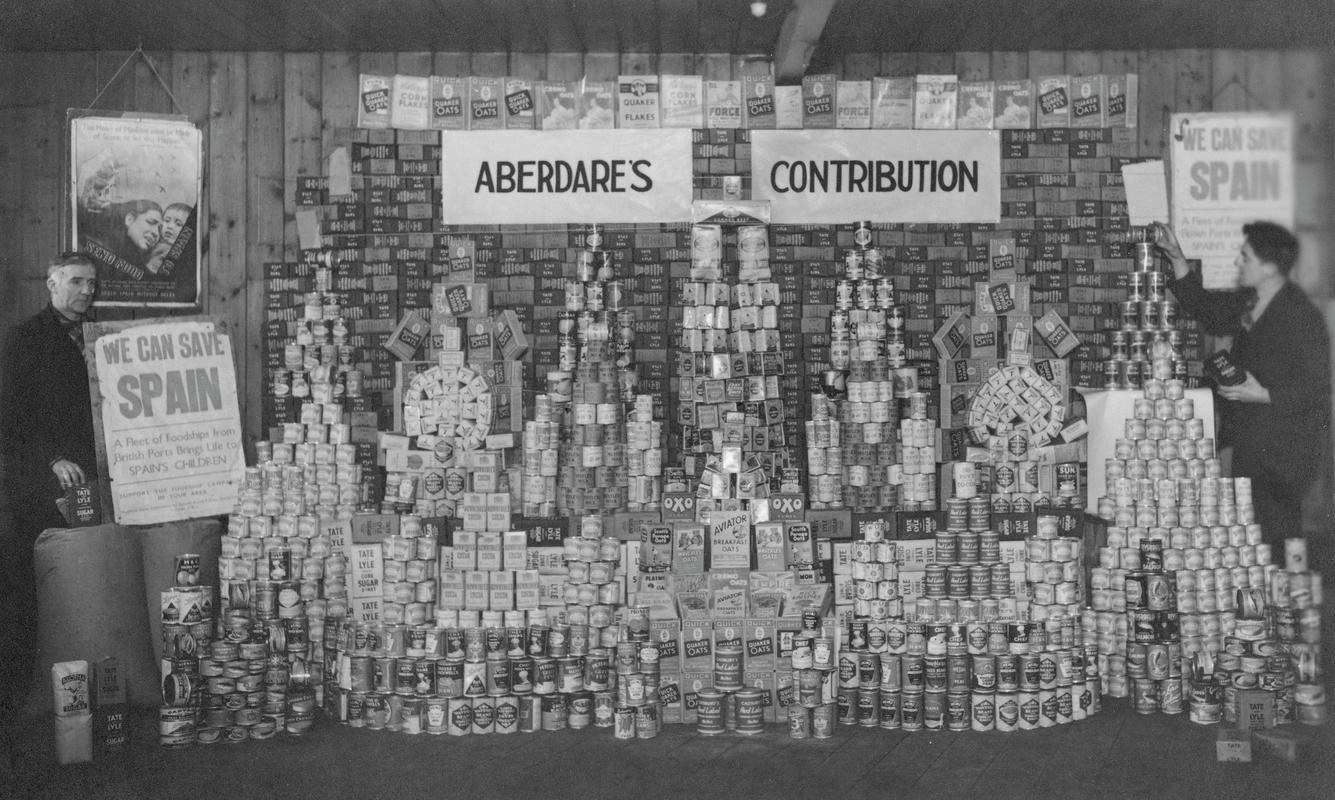 Aberdare's food contribution for child victims of the Spanish Civil War, with John Gentle on the left of the picture and Kalman Jones on the right.