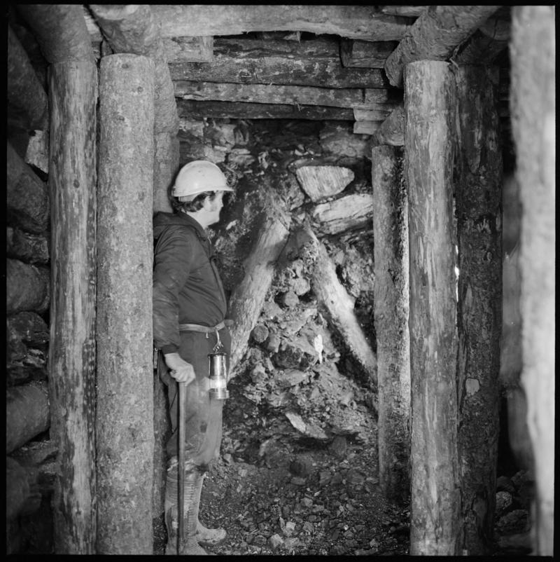 Black and white film negative showing a miner at the coal face, Big Pit Colliery.