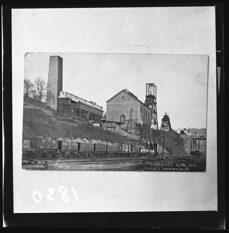 Black and white film negative of a photograph showing a surface view of Oakdale Colliery.  'Oakdale' is transcribed from original negative bag.