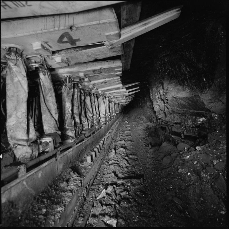 Black and white film negative showing chainless haualge on the face with Gullick Dobson powered supports, Betws Mine.  'Betws' is transcribed from original negative bag.