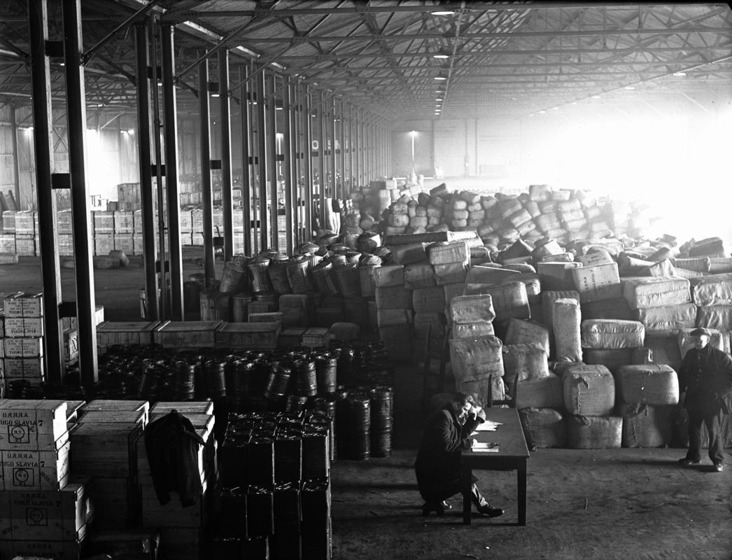 Interior of Cardiff docks warehouse full of UNRRA medical supplies for Yugoslavia