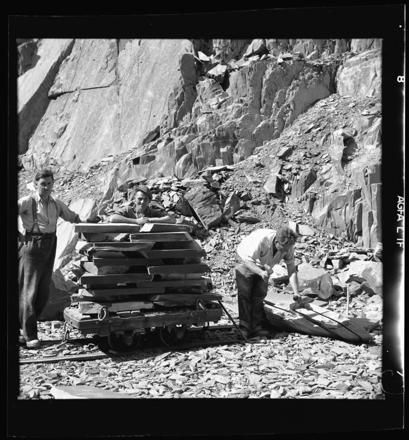 Quarrymen with a loaded 'flat car' of slate - 'slediad' - ready to be transported to the splitting and dressing sheds, Dinorwig Quarry, early 1960s.