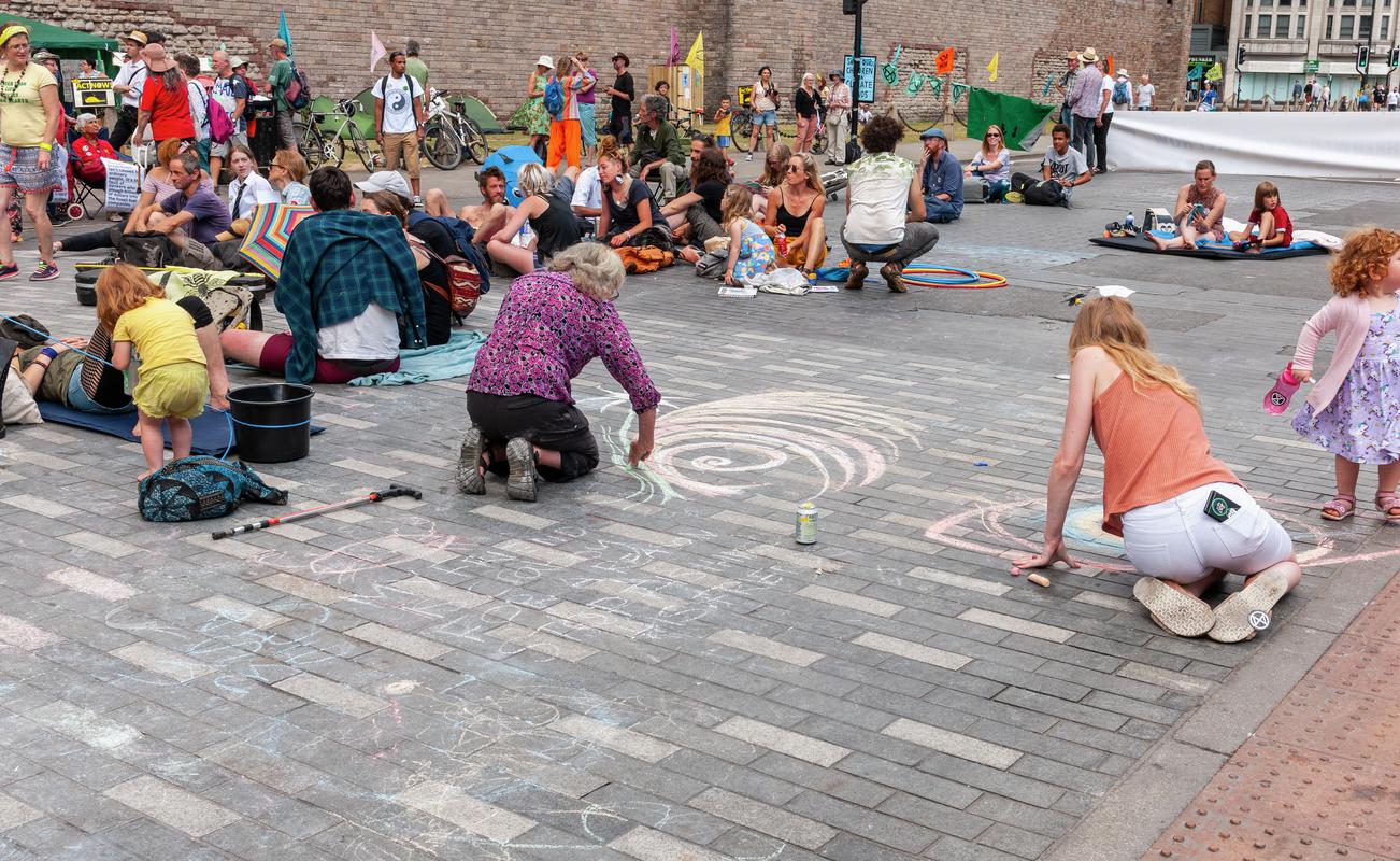 Extinction Rebellion Protest in Cardiff, blocking the road outside Cardiff Castle - pavement drawings.