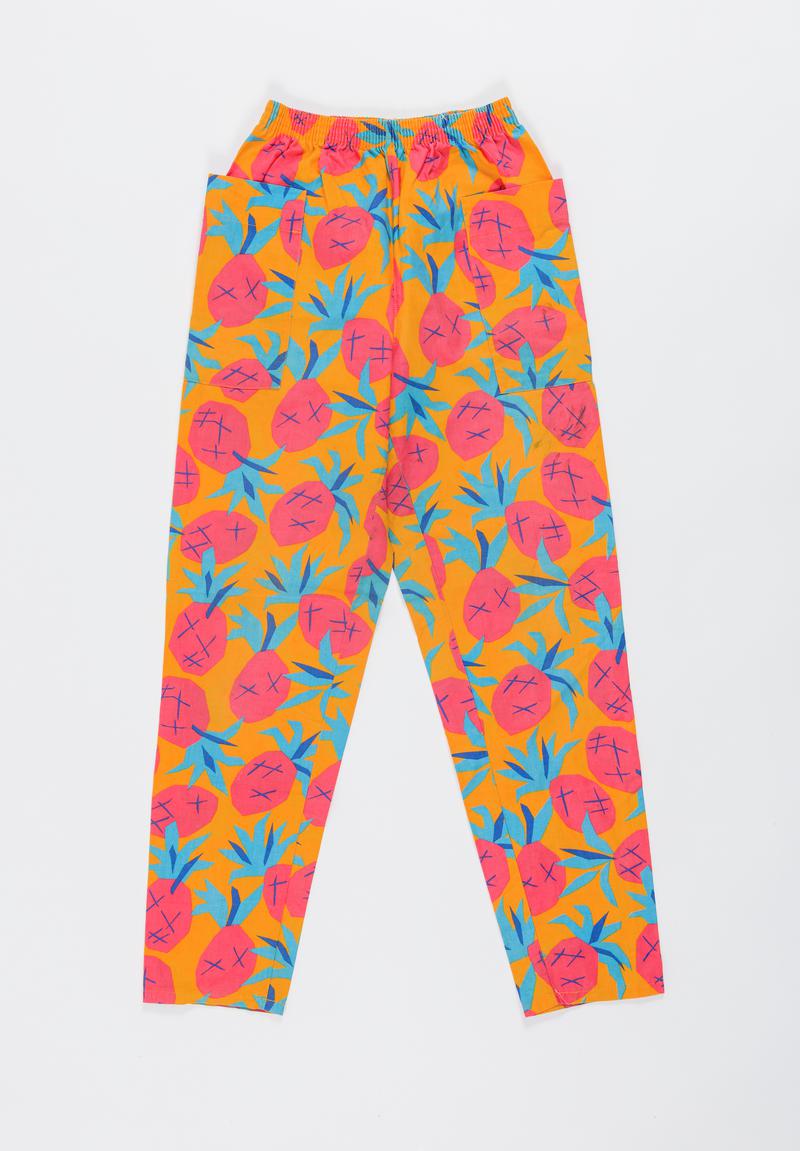 Orange, red and blue 'Pineapple design' trousers worn by Thalia Campbell on the march from Cardiff to Greenham Common, 27 August - 5 September 1981.