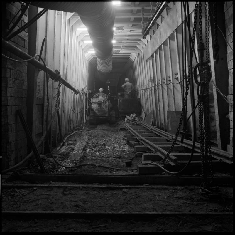 Black and white film negative showing an Eimco machine underground at Lady Windsor Colliery.