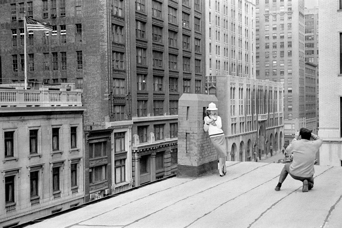 USA. NEW YORK. Lower Manhattan. Fashion Photography shoot plus the American Flag. 1962.