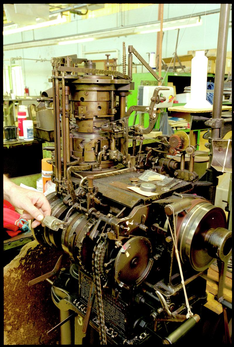 An automatic knittings sock knitting machine at Corgi Hosiery Ltd factory, Ammanford, 1 July 2002.