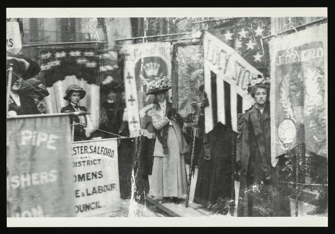 Black and white postcard of a photograph Banners were carried by Suffragists on their march from the Embankment to the Albert Hall on 17th June, 1908.