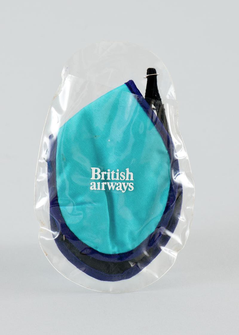 British Airways' blue eye cover with adjustable elasticated band in plastic pouch.