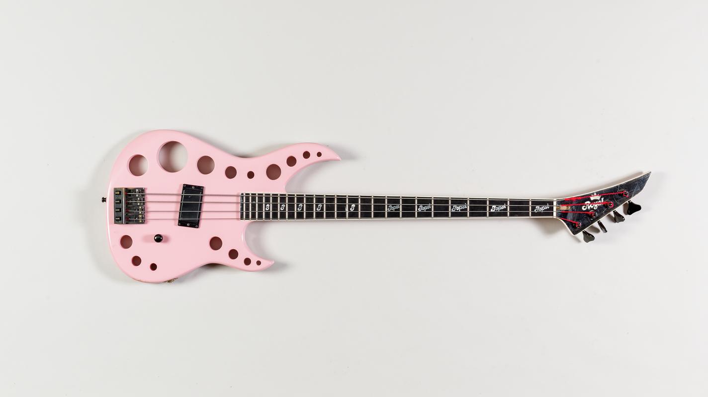 Pink Royal electric bass guitar. Played by band member Pepsi Tate of rock bank Tigertailz, and used in the 'Livin' Without You' video in 1988.