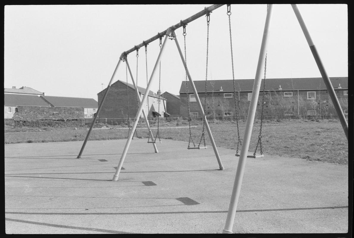 Swings in children's playground, on site of old canal.