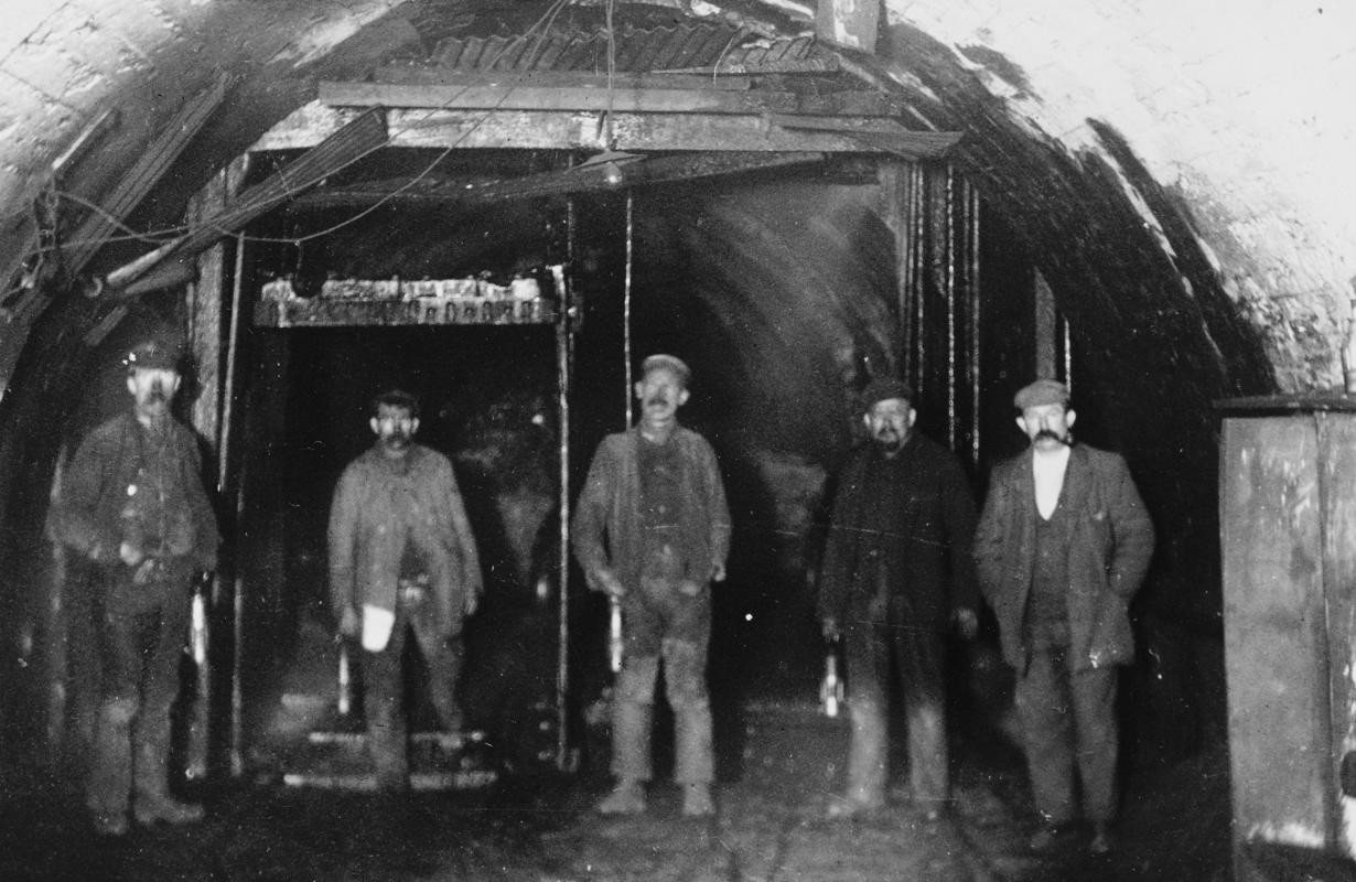 Miners with the cage at Coed Cae pit bottom, Lewis Merthyr Colliery, Trehafod