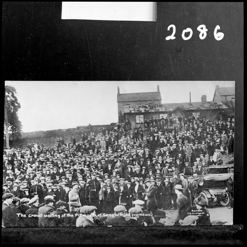 Black and white film negative of a photograph showing the scene at Universal Colliery, Senghenydd after the explosion of 14 October 1913.  Caption on photograph reads 'the crowd waiting at the pit mouth at Senghenydd for news'.
