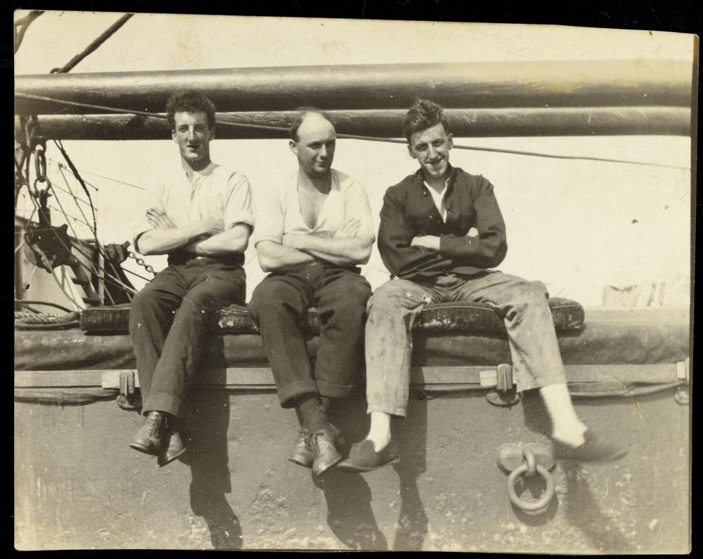 David Jenkins, ship's carpenter (centre), with two friends on unknown vessel.