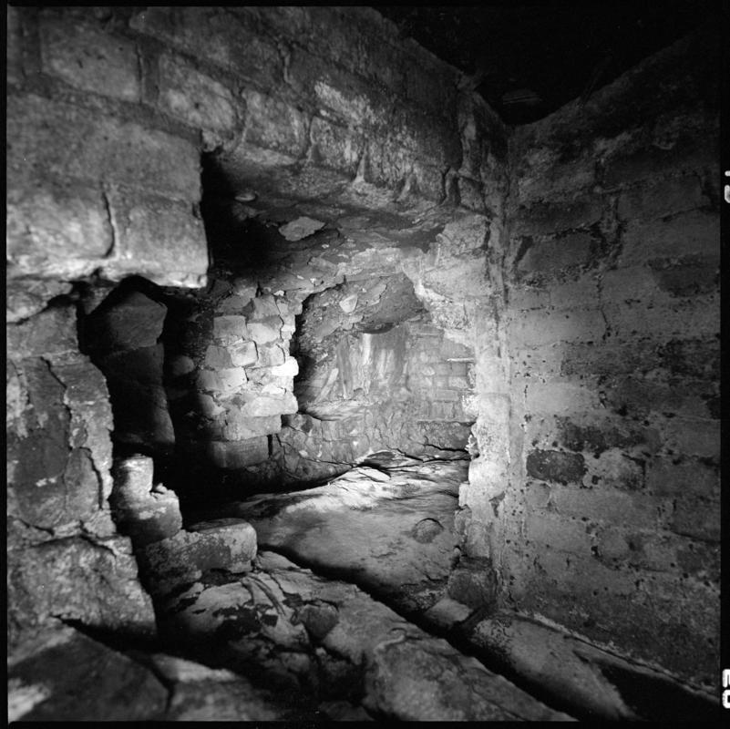 Black and white film negative showing the remains of a ventilation furnace at the No.3 landing, Hetty shaft, Tymawr Colliery March 1980.  'Hetty shaft No.3 landing, March 1980' is transcribed from original negative bag.