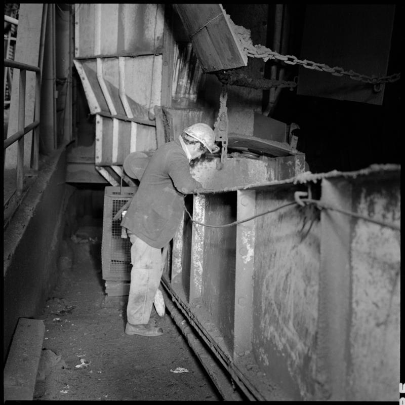 Black and white film negative showing a man at a transfer point, Betws Mine.  'Betws' is transcribed from original negative bag.