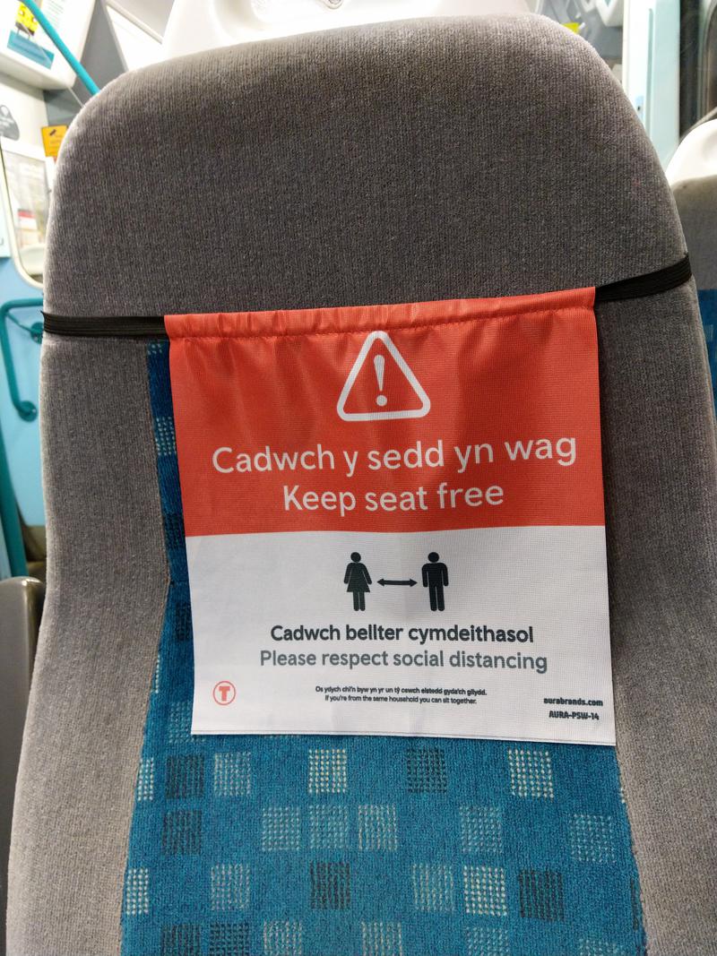 'Keep seat free' signs on Transport for Wales train between Radyr and Cardiff.