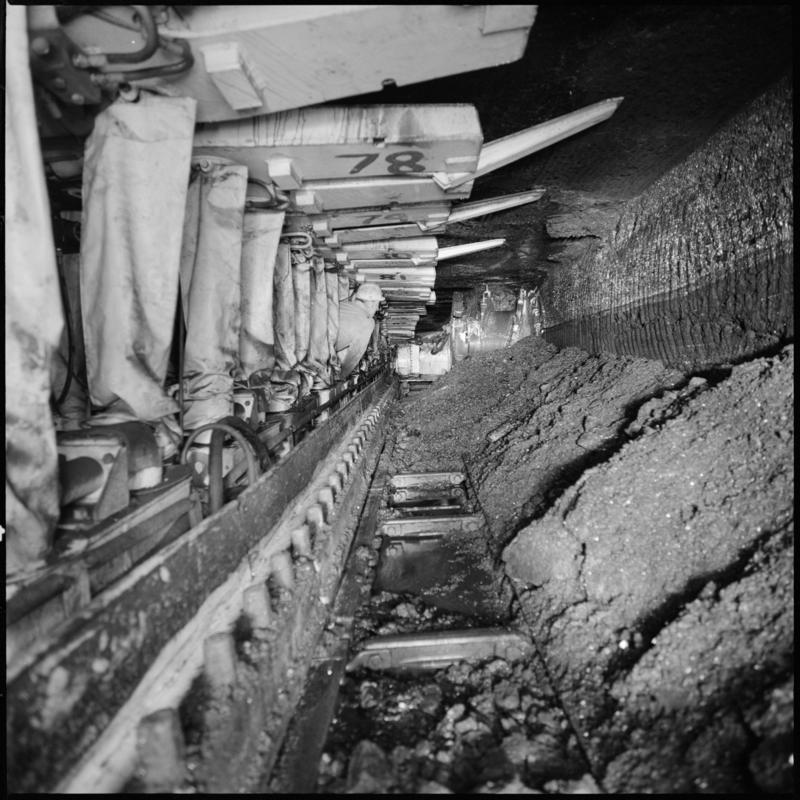 Black and white film negative showing chainless haulage on the face with Gullick Dobson powered supports, Betws Mine.  Appears to be identical to 2009.3/3080.