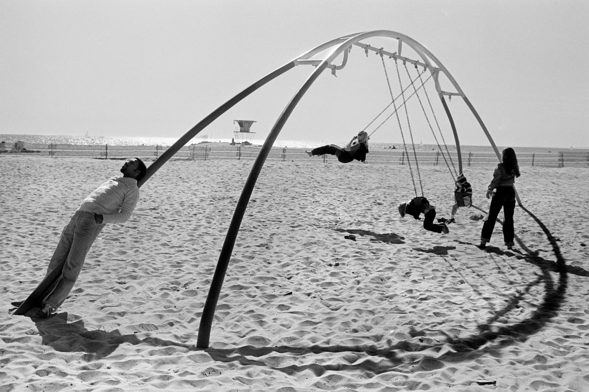 USA. CALIFORNIA. Santa Monica. Relaxing on the beach. 1980
