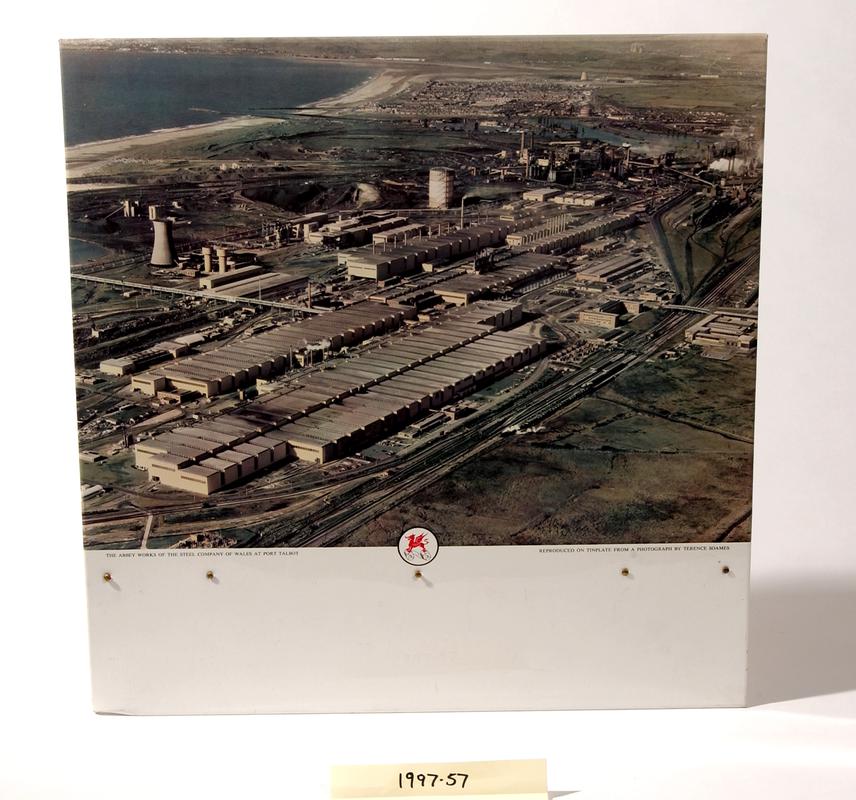 Colour photograph on tinplate showing aerial view of "The Abbey Works of the Steel Company of Wales at Port Talbot".