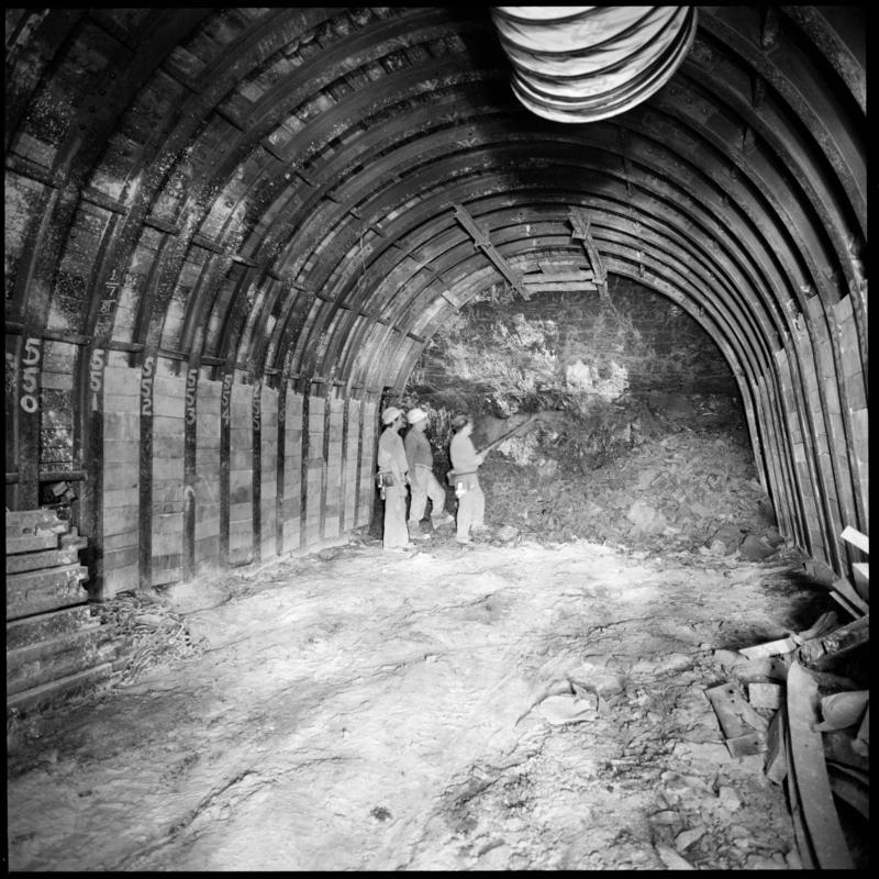 Black and white film negative showing three men at a heading, Merthyr Vale Colliery 2 July 1981.  '2 Jul 1981' is transcribed from original negative bag.