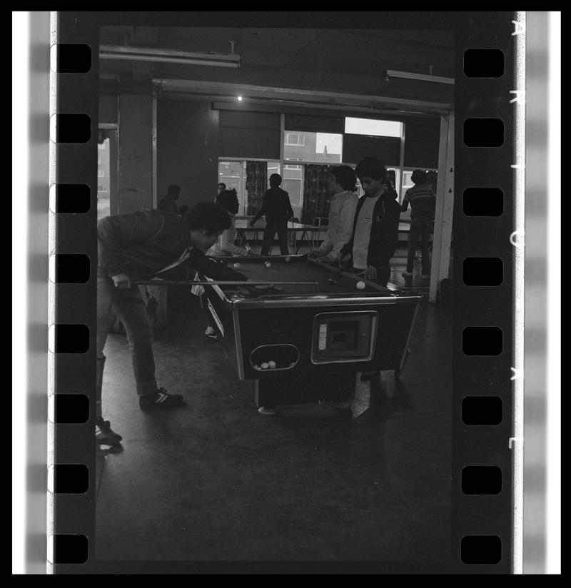 Teenagers playing pool at Butetown Youth Club.