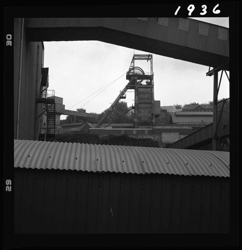 Black and white film negative showing a view of the upcast shaft headgear, Oakdale Colliery, May 1980.  'Oakdale May 1980' is transcribed from original negative bag.