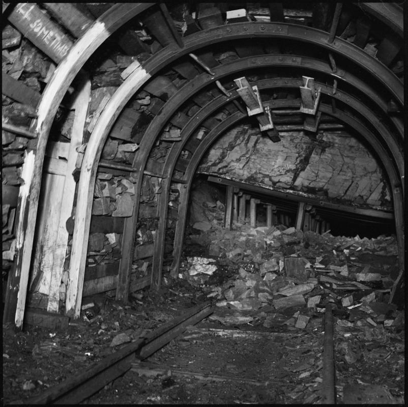 Black and white film negative showing an underground roadway under development, Treforgan Colliery.  'Treforgan' is transcribed from original negative bag.