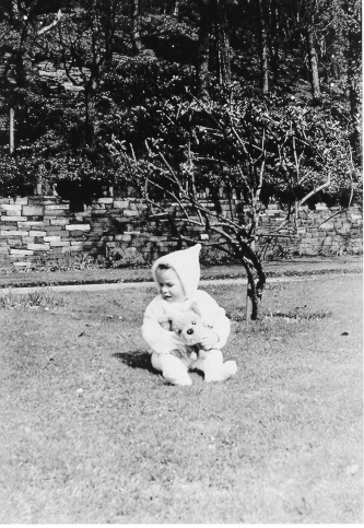 Dinorwig Quarry Hospital. Vivian Hughes as a young child on the lawn outside DQH.