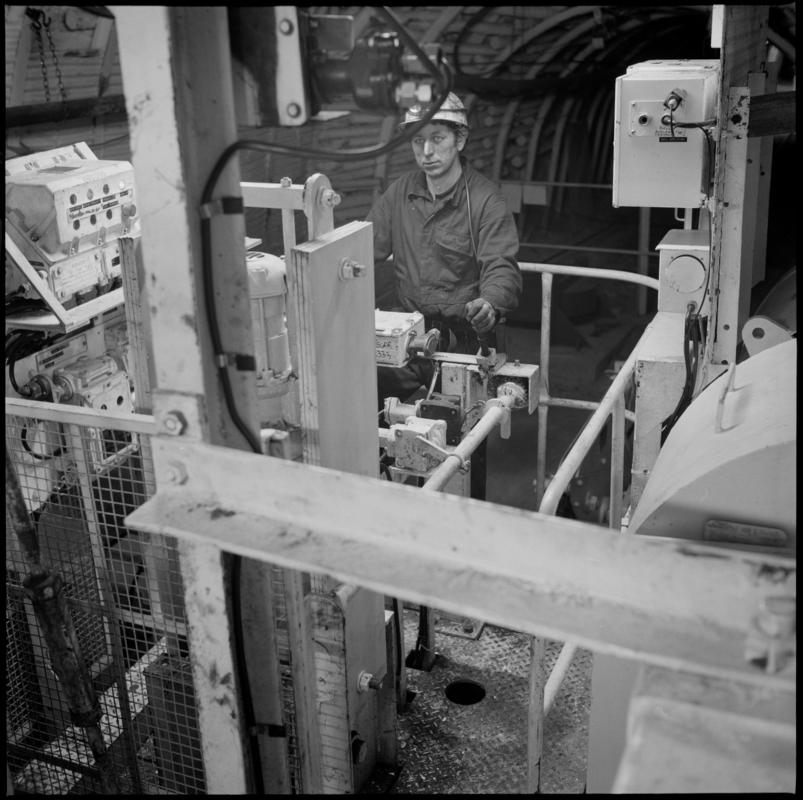 Colour film negative showing a man operating the haulage engine underground at Cwmtillery Colliery.  'Cwmtillery haulage' is transcribed from original negative bag.