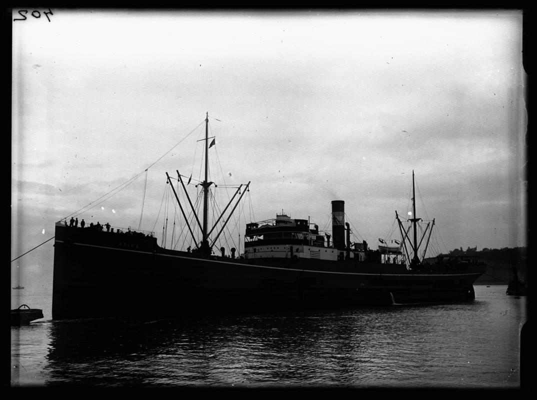3/4 Port bow view of the S.S. Axios with Watermans boat and tug, Penarth Head c.1936