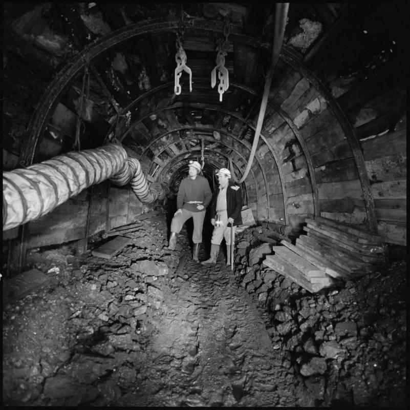 Black and white film negative showing two men underground, ?near Coity shaft, Big Pit Colliery.  Appears to be identical to 2009.3/3008.