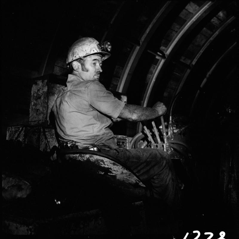 Black and white film negative showing a man operating an Eimco machine,  Blaengwrach Mine, 1 November 1979.  'Blaengwrach 1 Nov 1979' is transcribed from original negative bag.