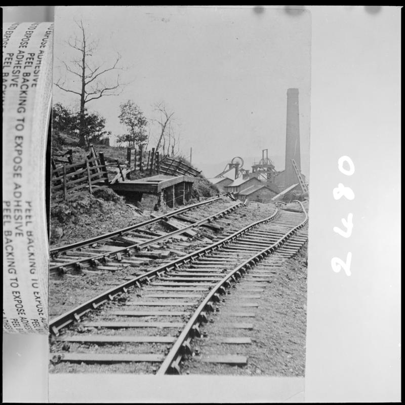 Black and white film negative of a photograph showing a landslip in ?Tredegar.  'Tredegar landslip' is transcribed from original negative bag.