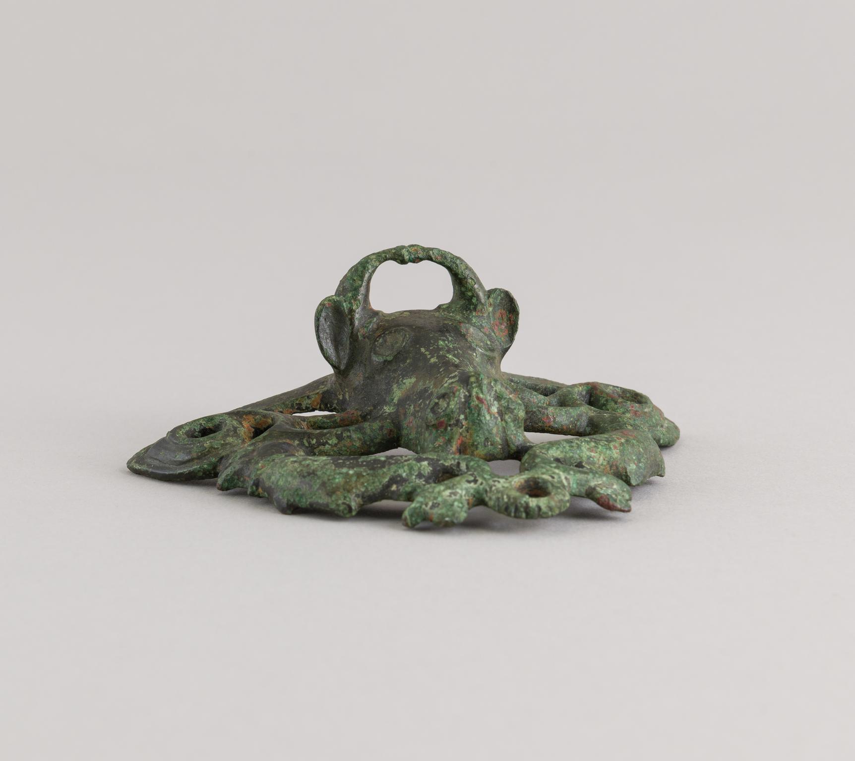 Roman copper alloy ox head escutcheon