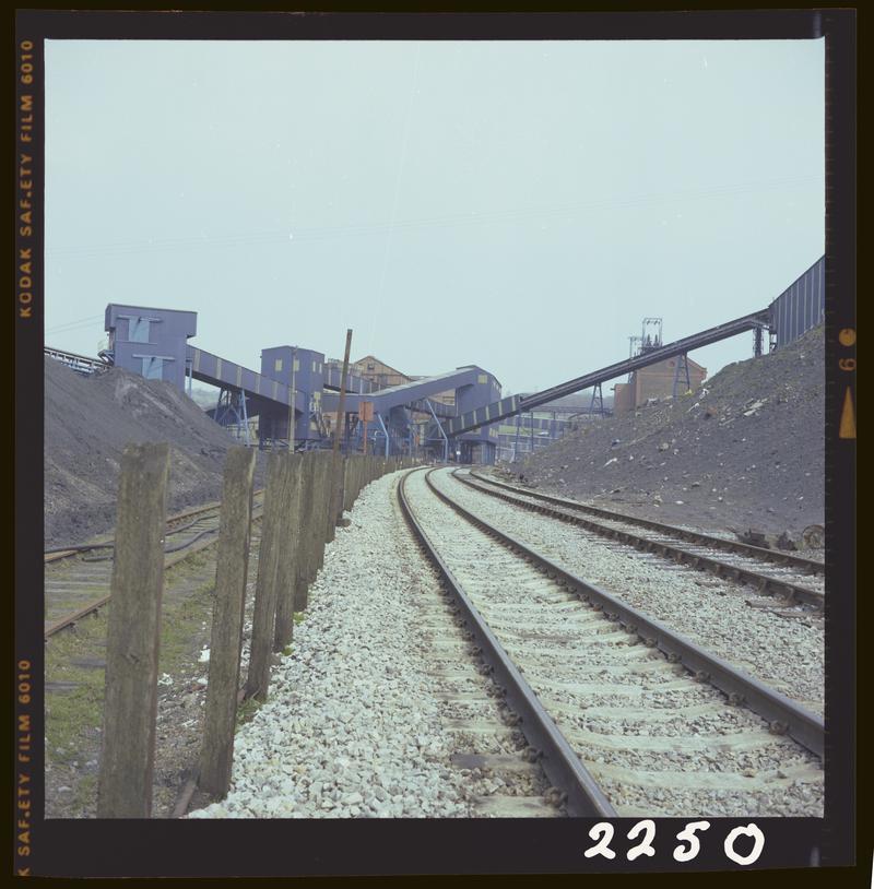 Colour film negative showing a surface view of Oakdale Colliery taken from the rail track, 16 April 1981.  'Oakdale 16 Apr 1981' is transcribed from original negative bag.  Appears to be identical to 2009.3/1737.