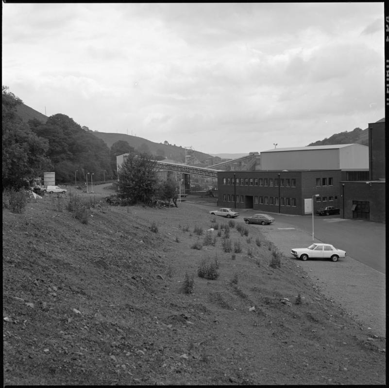 Black and white film negative showing Trelewis Mine offices with Taff Merthyr Colliery in the background.  'Trelewis' is transcribed from original negative bag.