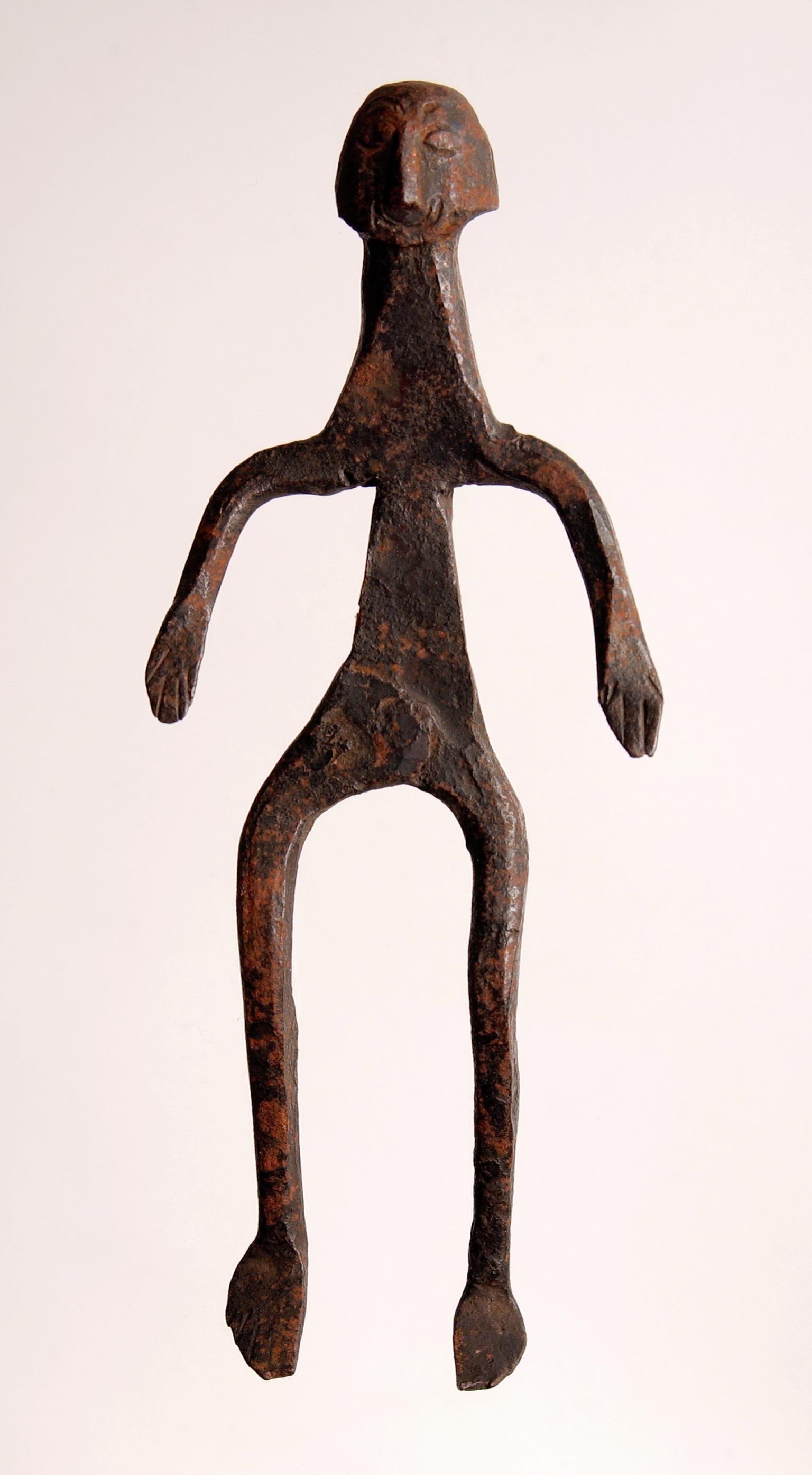 Spirit doll, made completely of iron, from the Congo; made to house the soul on a man's death; resembles a human body with head and face.