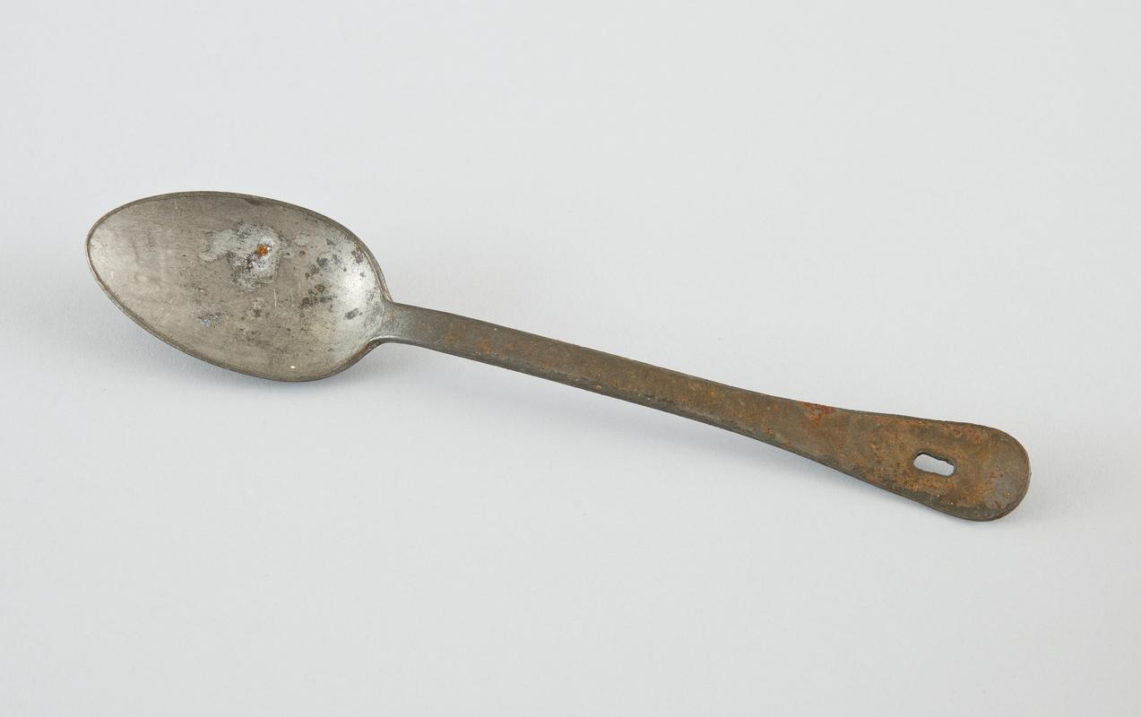 Large metal spoon inscribed 1007/12 on reverse, with hole at end of handle for suspension.