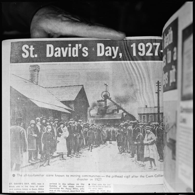 Black and white film negative showing 'the pithead vigil after the Cwm Colliery disaster in 1927', photographed from a publication.